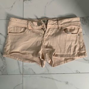 Peach colored jean shorts